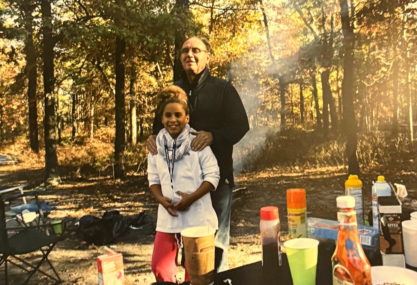 Simone as a kid with her grandfather, Pop, on a fall camping trip